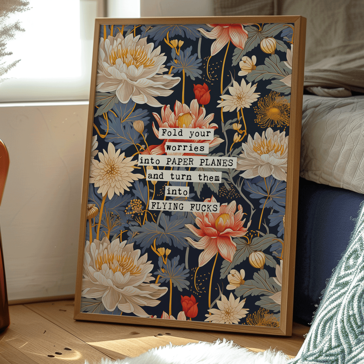 Thoughtful inspirational print, floral background in blue, with red and white water lily style flowers, saying FOLD YOUR WORRIES INTO PAPER PLANES AND TURN THEM INTO FLYING FUCKS. Sweary gallery wall art print
