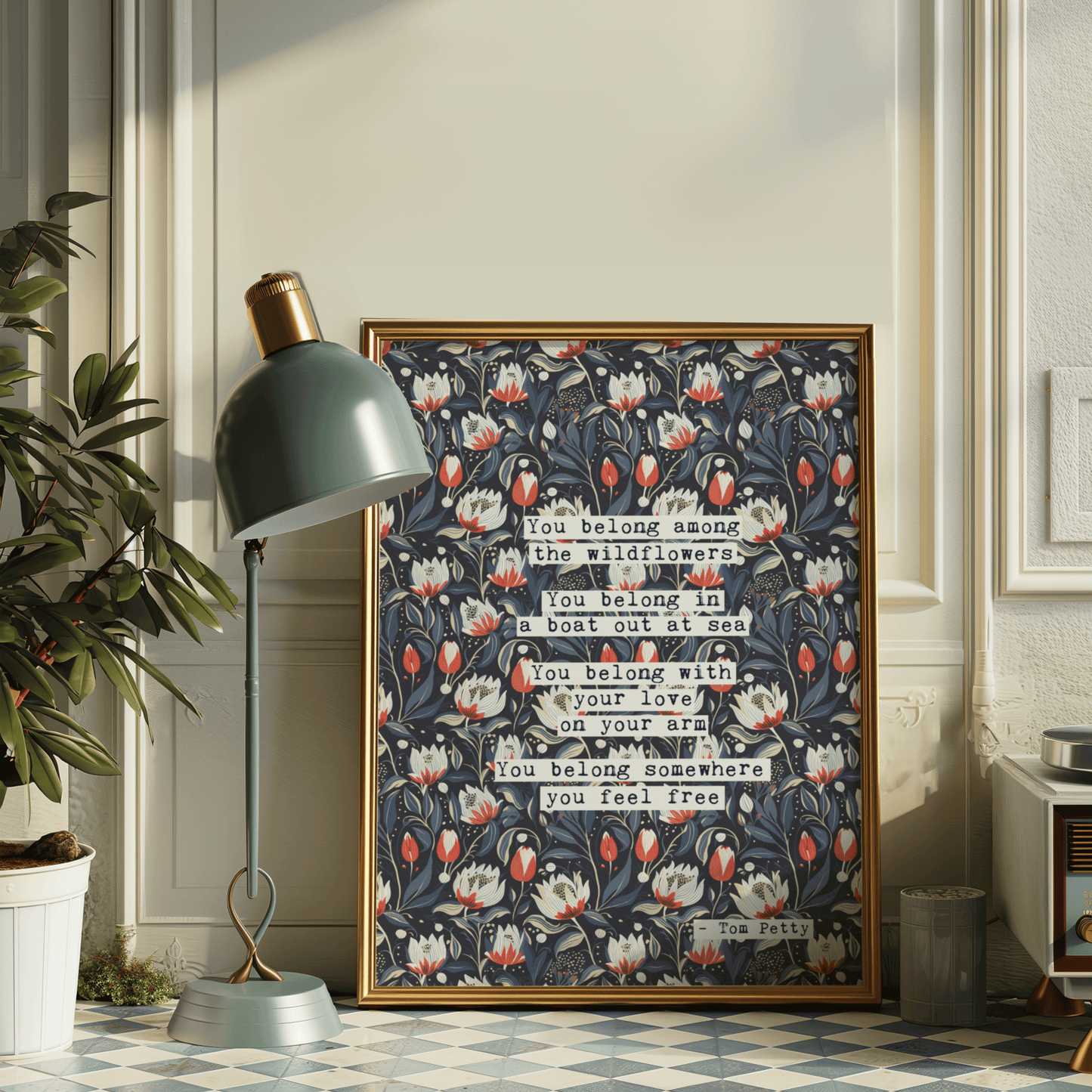 Thoughtful inspirational print, with Tom Petty quote, on floral background in navy, with red-white and blue-green flowers, saying YOU BELONG AMONG THE WILDFLOWERS. YOU BELONG IN A BOAT OUT AT SEA, YOU BELONG WITH YOUR LOVE ON YOUR ARM. YOU BELONG SOMEWHERE YOU FEEL FREE. Gallery wall art print
